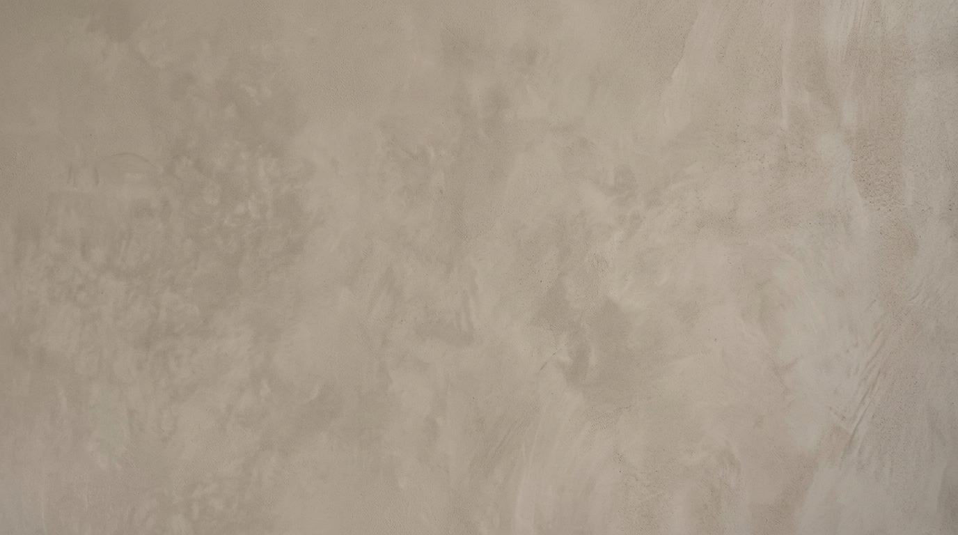 Finished traditional lime plaster wall with soft mottled tonal variation and gentle trowel texture, by SJM Plastering